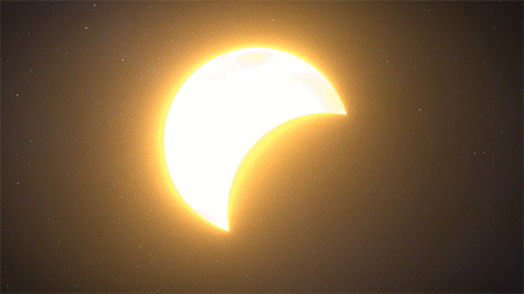 What causes a solar eclipse, why is it both harmful and fascinating?